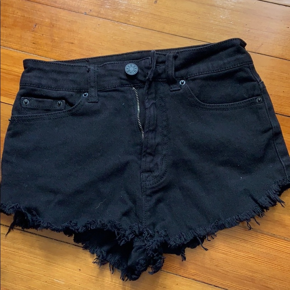 Black high rise jean shorts with cut edges